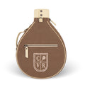 A brown teardrop-shaped padel bag with cream-colored trim, a top strap, and a front zippered pocket featuring a cream shield logo with the letters C, V, and R and a tennis racket icon. The bag is photographed on a clean white background with a soft shadow.