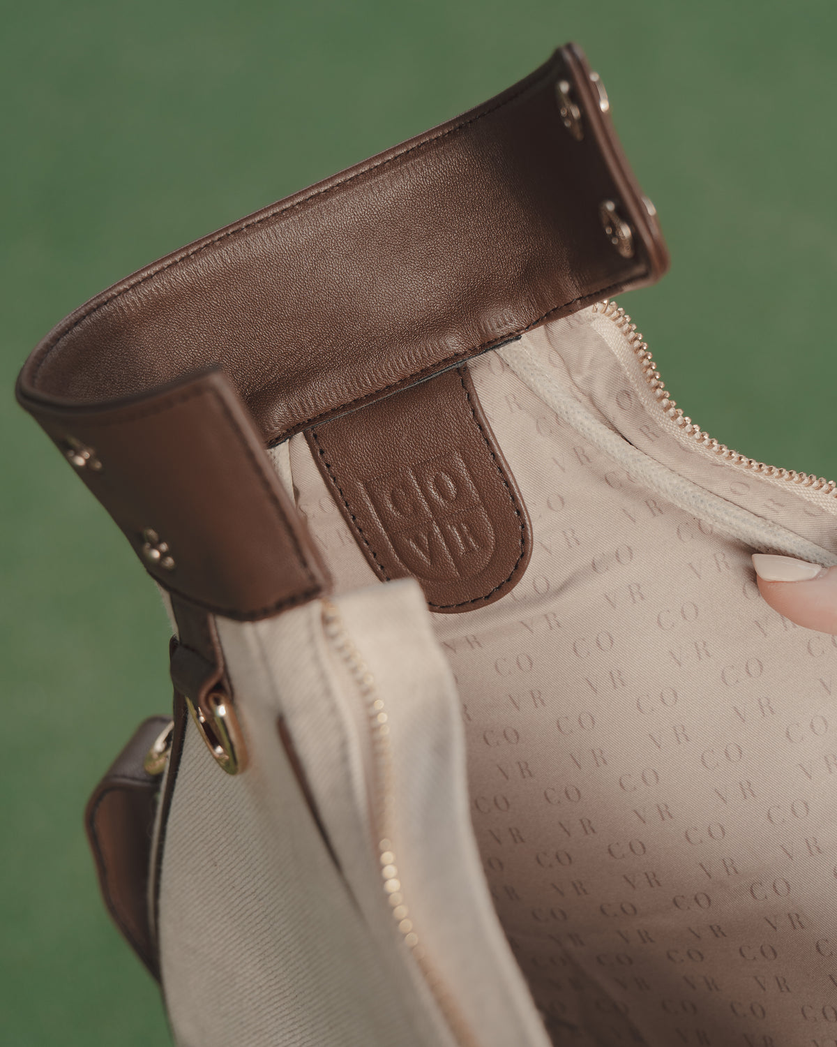 The leather collar with press studs over the COVR monogram lining