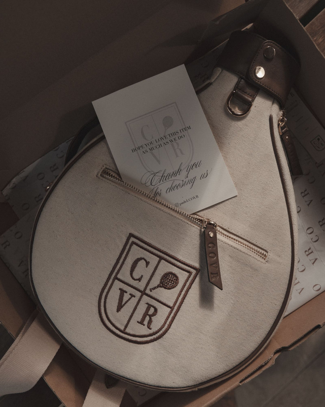 A cream COVR cover in its box with a thank-you card